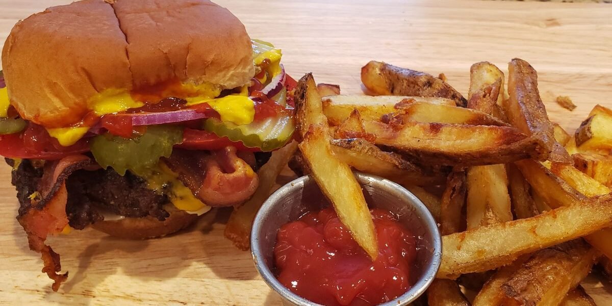 bacon cheese burger and french fries