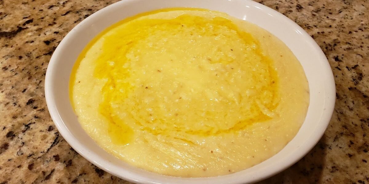 cheese grits in a bowl with butter melted on top