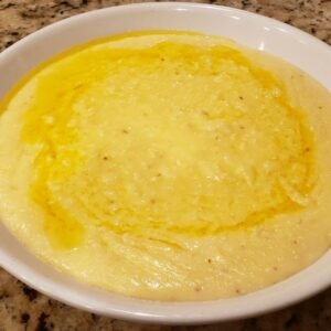 cheese grits in a bowl with butter melted on top