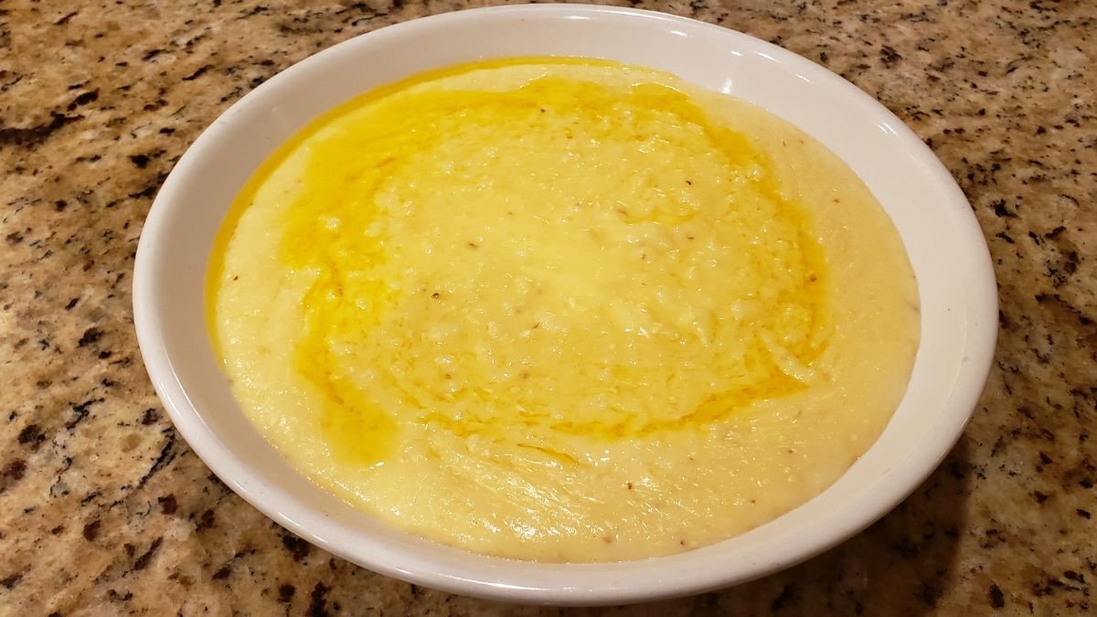 cheese grits in a bowl with butter melted on top