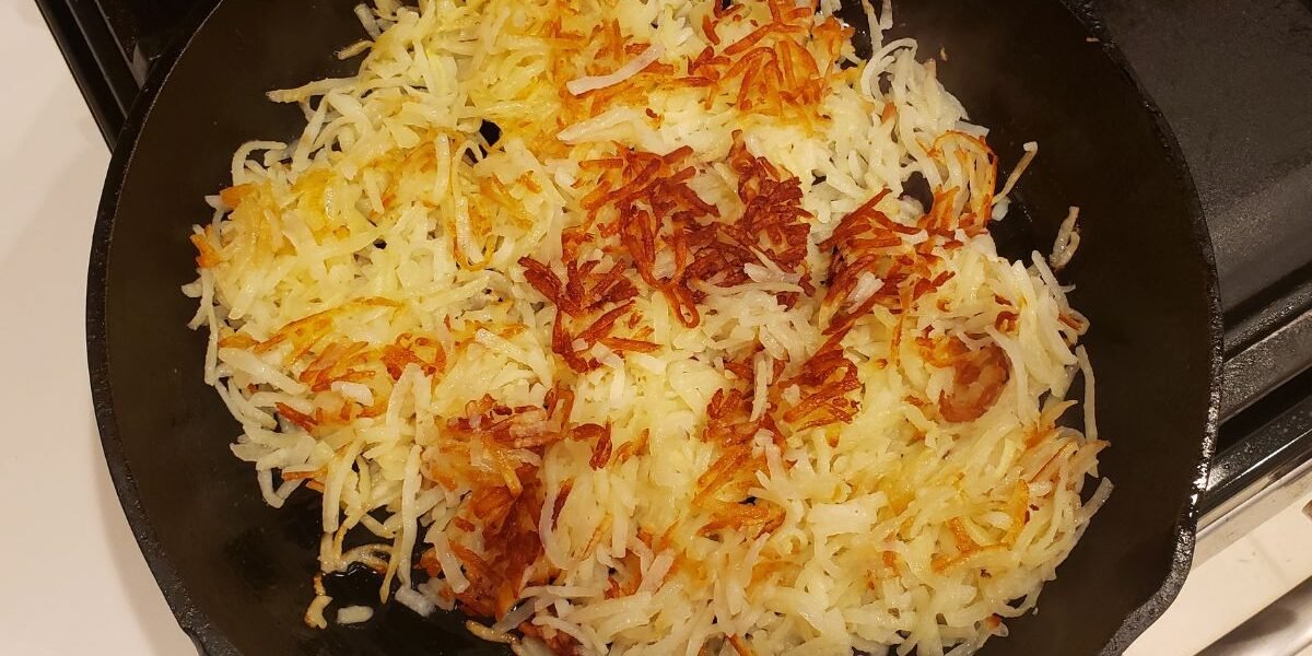 hashbrowns in a cast iron skillet