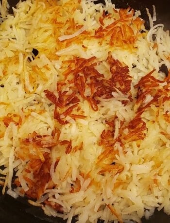 hashbrowns in a cast iron skillet