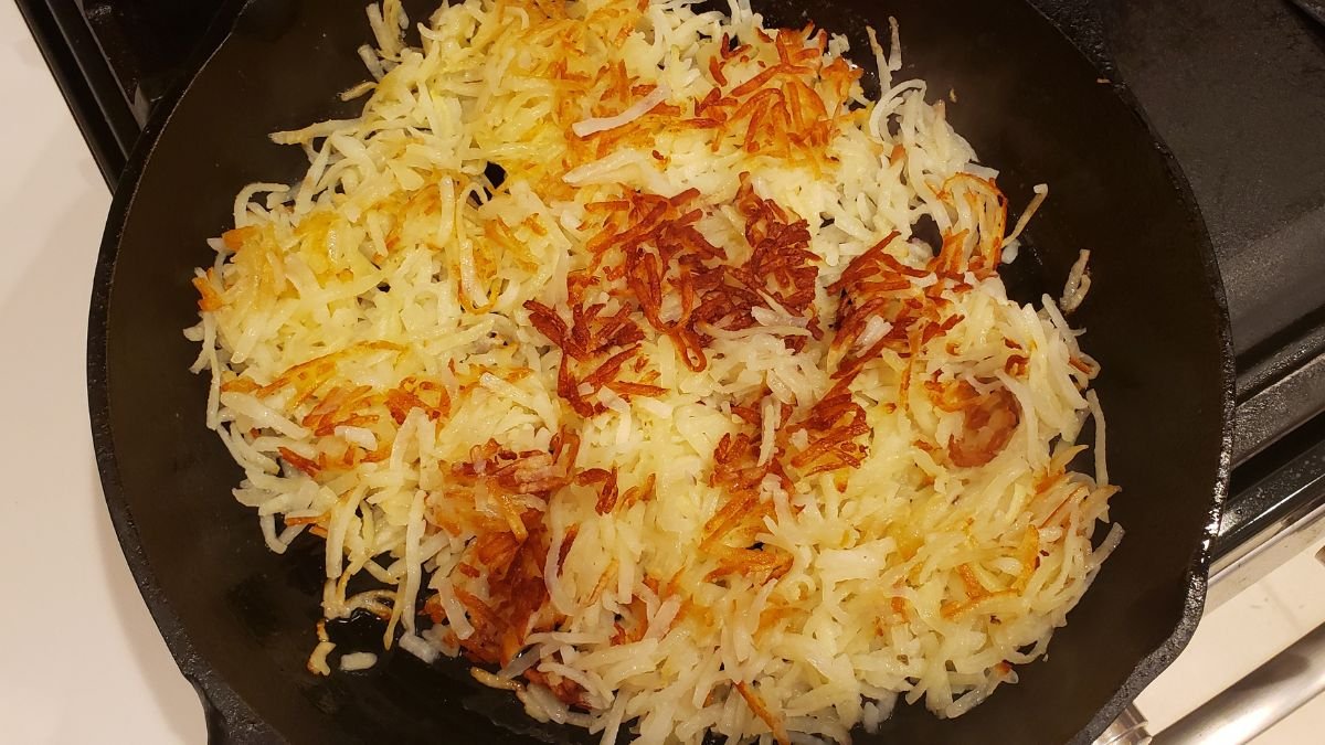 hashbrowns in a cast iron skillet