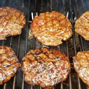 six burgers on a grill
