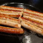 breakfast sausage links in cast iron pan