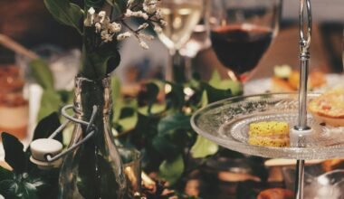 clear glass 2-tier plate beside flower arrangement